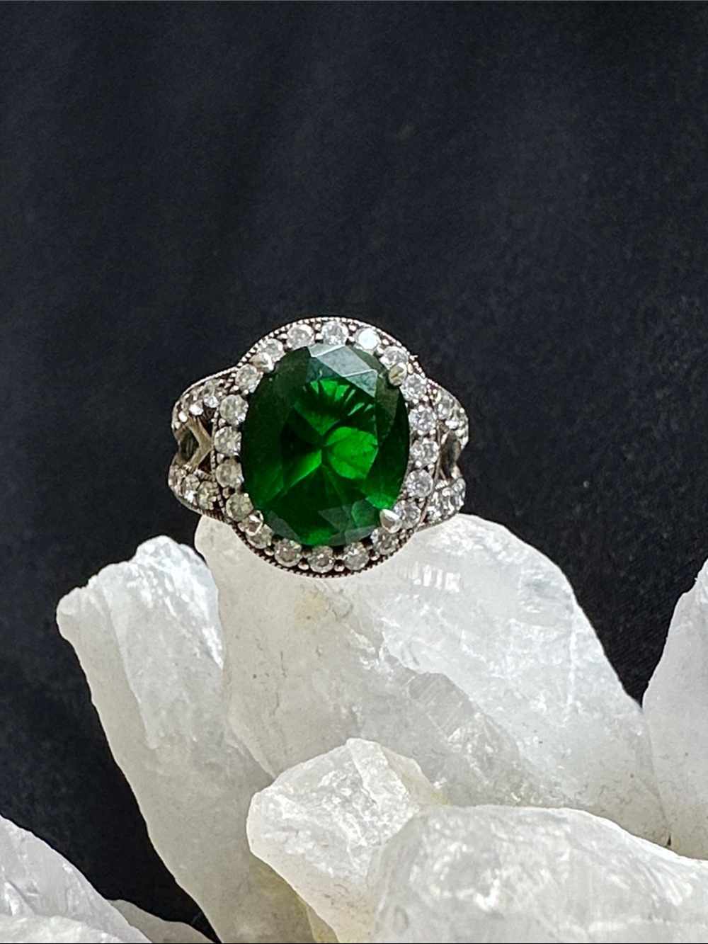 Sterling & glass EUC ring. Green oval glass stone w/ CZ halo set in 925 silver